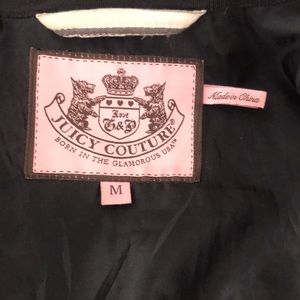 Lady’s jacket size  M Juicy Couture black  with zipper in front and small packet
